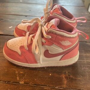 Nike Pink and White Sneakers with Iconic Swoosh